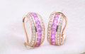 Pink Sapphire Channel Huggie Earrings in 18K rose gold — view 1
